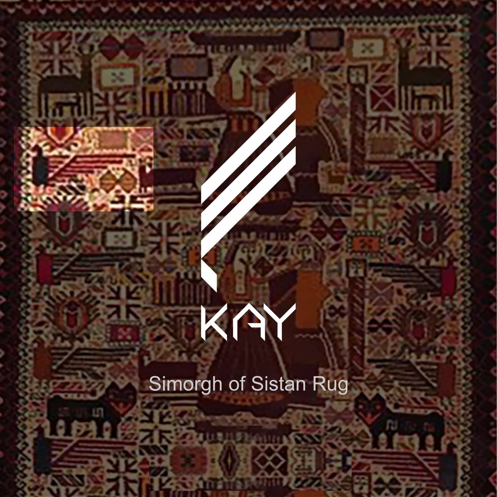 The KAY monogram set over the Simorgh of Sistan rug, a dense geometric weave of animals and stepped diamonds in madder red, ochre and undyed wool